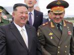 korea-utara-kim-jong-un-dan-menteri-pertahanan-rusia-sergei-shoigu-64nko.jpg