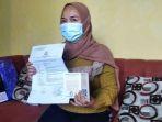 kw-saat-menunjukkan-buku-nikah-dan-laporan-polisi-di-mapolresta-bandar-lampung.jpg