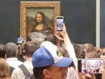 lukisan-mona-lisa-terkena-krim.jpg