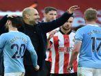 manajer-manchester-city-pep-guardiola-bereaksi-setelah-memenangkan-laga.jpg