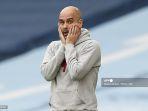 manajer-manchester-city-pep-guardiola-memberi-isyarat-di-tepi-lapangan.jpg