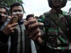massa-aksi-terlibat-bentrokan-dengan-aparat-kepolisian_20190522_151544.jpg