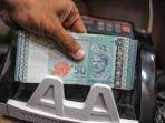 mata-uang-ringgit-malaysia-kembali-melanjutkan-penurunan.jpg