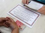membayar-zakat-fitrah-di-pusdai-bandung_20180614_141310.jpg