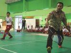 menpora-imam-nahrawi-saat-bermain-bukutangkis.jpg
