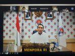 menpora-zainudin-amali-saat-melakukan-konferensi-pers-secara-daring.jpg