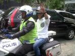 menteri-ketenagakerjaan-hanif-dhakiri-naik-motor-polisi_20150314_010655.jpg