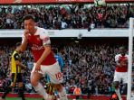 mesut-oezil-merayakan-golnya-untuk-arsenal_20180930_033915.jpg