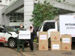 mitsubishi-memberikan-apd-kepada-nakes-di-wisma-atlet.jpg