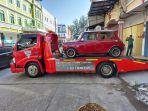 mobil-mewah-kepunyaan-mantan-pejabat-bea-cukai-andhi-pramono-disita-kpk-1.jpg