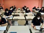 murid-di-vietnam-kembali-sekolah-setelah-3-bulan-diliburkan-karena-covid-19-tetap-pakai-masker.jpg