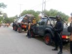 nggota-brimob-sedang-berjaga-jaga-di-depan-gang-rumah-terduga-teroris_20180517_185150.jpg