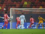 olivier-giroud-kiri-mencetak-gol-pada-pertandingan-leg-pertama-babak-16-besar-liga-champions.jpg