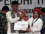pasangan-agus-sylviana-daftar-pilgub-dki-jakarta_20160923_215021.jpg