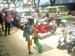 pasangan-suami-istri-berkelahi-di-jalan-sam-ratulangi-ambon.jpg