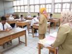 pelaksanaan-ujian-nasional-smp-tangerang_20160509_155106.jpg