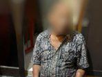 pelaku-pembakaran-orang-di-samping-polsek-sawahan-surabaya-saat-berhasil-diamankan.jpg