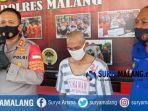 pelaku-rudapaksa-anak-kandung-ns-saat-dipaparkan-dalam-rilis-di-polres-malang.jpg