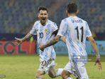 pemain-argentina-lionel-messi-kiri-merayakan-dengan-angel-di-maria-setelah-mencetak-gol.jpg