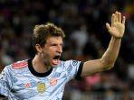 pemain-depan-bayern-munich-jerman-thomas-mueller-merayakan-golnya.jpg