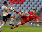 pemain-depan-bayern-munich-robert-lewandowski-kanan-mencetak-gol-3-0.jpg