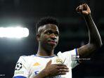 pemain-depan-real-madrid-brasil-vinicius-junior-melambai-kepada-pendukungnya.jpg