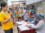 pemeriksaan-kesehatan-balita-di-posyandu-teratai-bandung_20211113_115320.jpg
