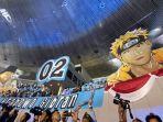 pendukung-membentangkan-spanduk-bergambar-anime-prabowo-gemoy-dan-gibran-naruto.jpg