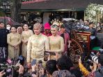 pengantin-kaesang-pangarep-erina-gudono-menaiki-kereta-kencana_20221211_124553.jpg