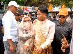 pengantin-ngamuk-ke-pendemo-karena-resepsinya-sepi.jpg