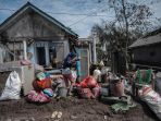 pengungsi-erupsi-semeru-mulai-bersihkan-rumah_20211209_091101.jpg