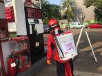 penyemprotan-disinfektan-di-area-spbu.jpg