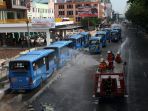 penyemprotan-disinfektan-massal-di-kota-pekanbaru_20200331_154219.jpg