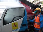 penyemprotan-disinfektan-pada-mobil-operasional-pln_20200407_231144.jpg