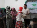 penyerahan-bantuan-bagi-fakir-miskin-dan-dhuafa.jpg