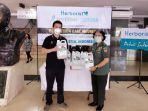 penyerahan-donasi-hand-sanitizer-herborist.jpg
