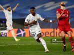 penyerang-real-madrid-vinicius-junior-melakukan-selebrasi-setelah-mencetak-gol-ke-gawang-alisson.jpg