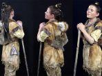 perempuan-dari-zaman-batu-didandani-dengan-pakaian-yang-terbuat-dari-bulu-hewan.jpg