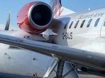 pesawat-flybe-bombardier-q400-terjepit.jpg