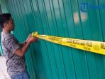 polisi-memansang-police-line-di-kantor-net-invest-manado-beberapa-waktu-lalu_20170606_130521.jpg
