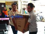 polisi-membawa-kardus-berisi-uang-mainan-milik-mujiono_20180321_122527.jpg