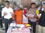 polisi-membeber-barang-bukti-uang-uang-palsu.jpg