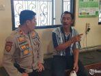 polisi-memeriksa-juru-parkir-panut-atas-kasus-pungutan-liar-di-alun-alun-kota-malang.jpg