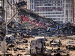 potret-hancurnya-mal-di-kyiv-terkena-serangan-rudal-rusia_20220322_201734.jpg