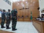 praka-riswandi-terdakwa-pembunuhan-terhadap-imam-masykur.jpg