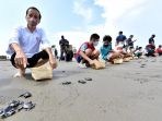 presiden-jokowi-melepas-tukik-di-pantai-kemiren-cilacap_20210923_201941.jpg