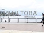 presiden-jokowi-tinjau-penataan-kawasan-pantai-bebas-parapat_20220203_065718.jpg