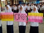 ratusan-siswa-dan-guru-smp-islam-diponegoro-solo-gelar-aksi-solidaritas_20180205_194742.jpg