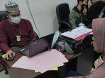reni-lapor-ke-polisi.jpg