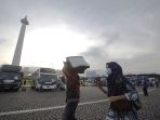 ribuan-orang-antusias-ikuti-mudik-gratis-pemprov-dki-jakarta_20230417_121010.jpg